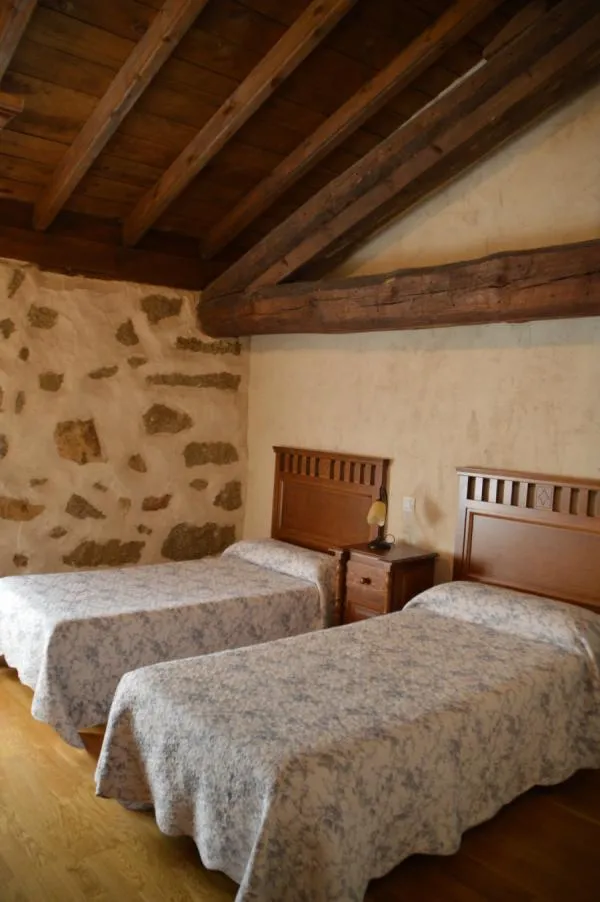 Dormitorio en Salón de Casa Rural El Molino I en San Bartolomé de Pinares